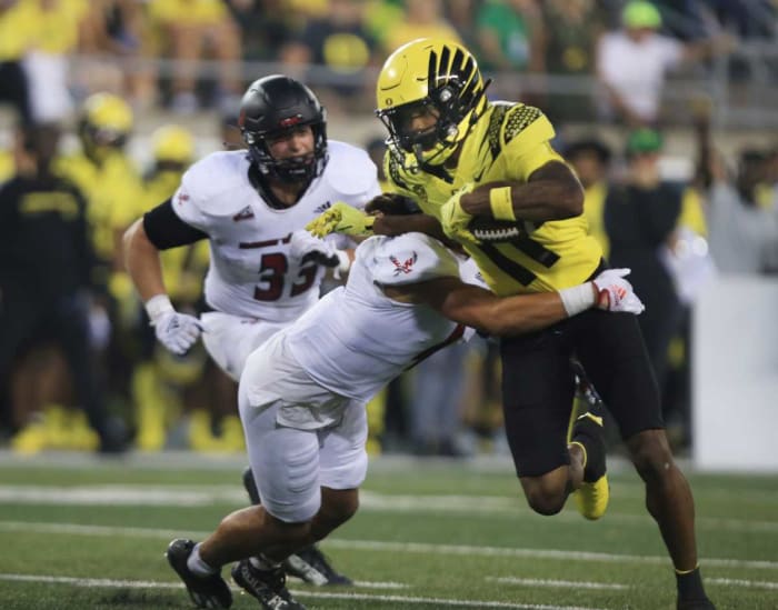 Oregon Ducks wide receiver Troy Franklin fights through a tackle against Eastern Washington.